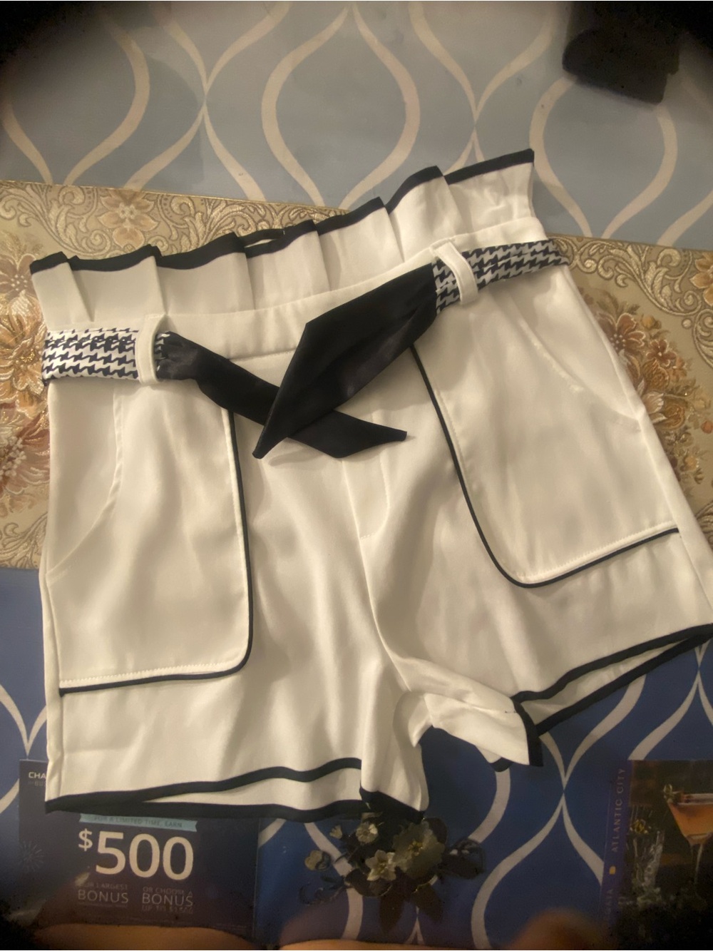 High-Waist White Shorts with Black Trim and Houndstooth Tie